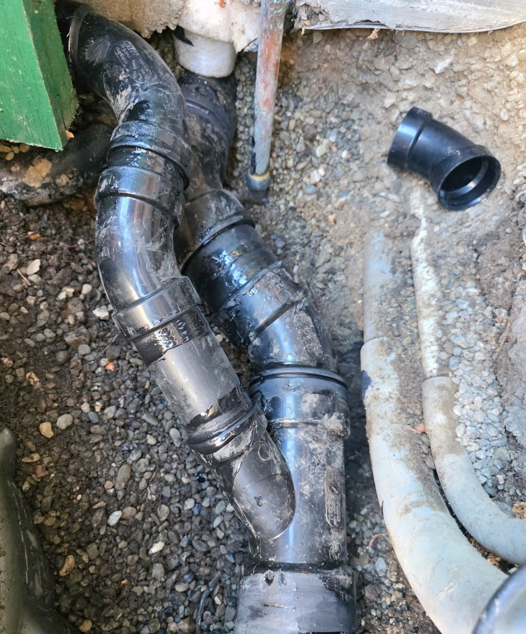 Crawl space sewer line repair — the first block of Clinton St